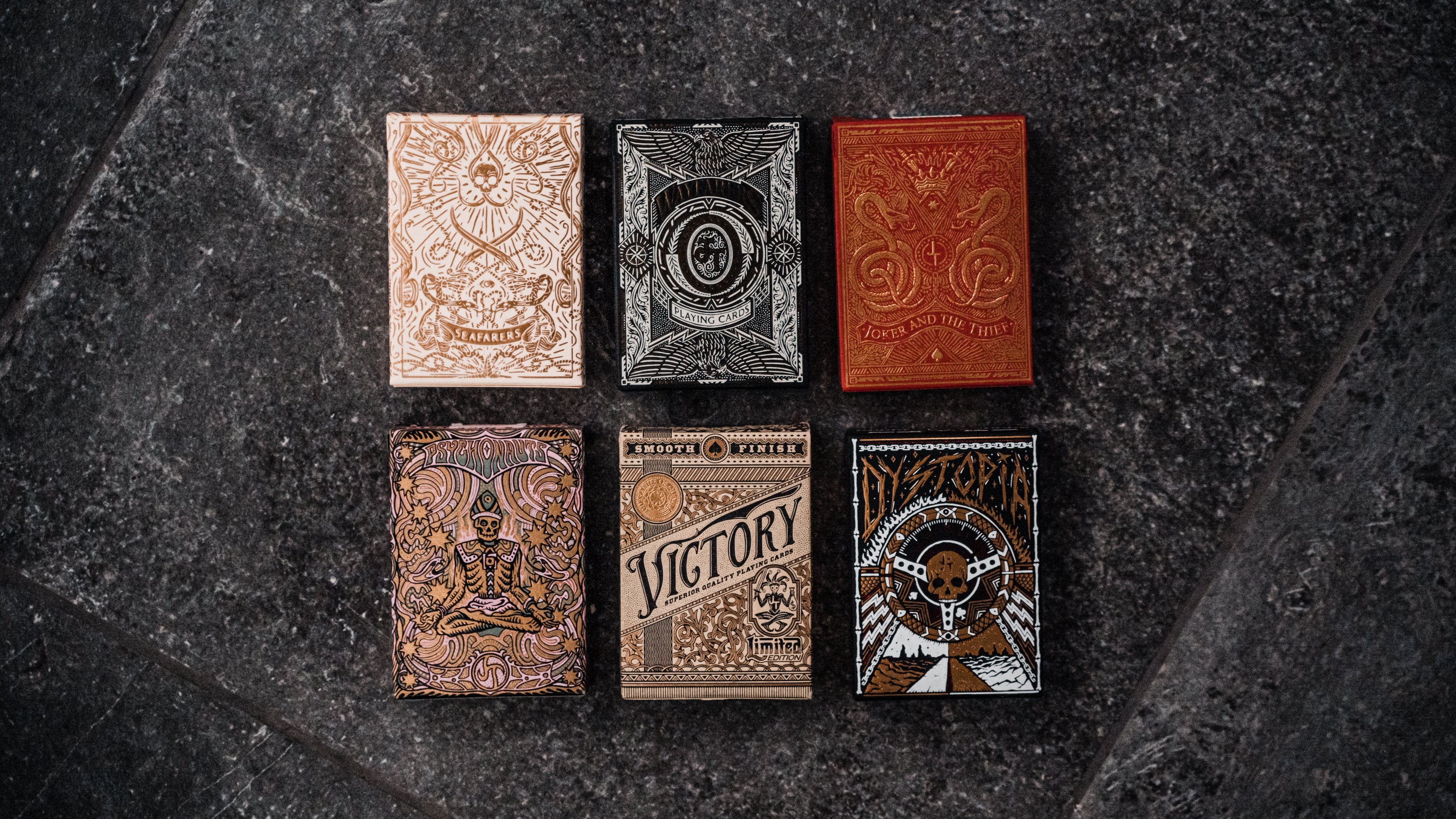 6 decks of joker and the thief decks on display